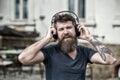 Hipster enjoy high quality sound of song in headphones. Get music subscription. Enjoy free songs everyday. Excellent