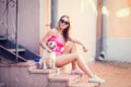 Hipster Fashion Girl with Her Dog in the City Royalty Free Stock Photo