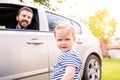 Hipster father in the car and his little daughter Royalty Free Stock Photo