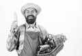 Hipster gardener wear apron carry vegetables. Farmer straw hat hold corncob and basket vegetables. Fresh organic Royalty Free Stock Photo