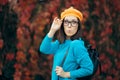 Funny Woman with Eyeglasses and Pumpkin Beret Enjoying Autumn Royalty Free Stock Photo