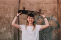 Hipster girl with skate board Royalty Free Stock Photo