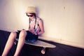 Hipster Girl Skateboarder listening to the music Royalty Free Stock Photo