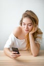 A hipster girl typing a message while resting