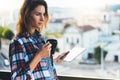 Hipster girl using tablet technology and drink coffee, social distance concept, girl person holding computer on background sun