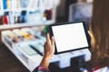 Hipster girl using tablet technology in home, blogger girl person holding computer with blank screen on background bokeh, female Royalty Free Stock Photo