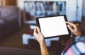 Hipster girl using tablet technology in home, blogger girl person holding computer with blank screen on background bokeh, female Royalty Free Stock Photo