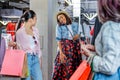 Hipster girls choosing clothes in boutique, fashion shopping girls concept Royalty Free Stock Photo