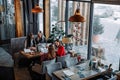 Hipster girls sitting in coffee shop and organizing details of cooperation