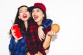 Hipster girls with vegetarian burger drinking a soda from straw and having fun, happy, smile and laugh on the white