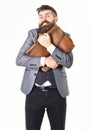 Hipster with greedy face and vintage briefcase. Royalty Free Stock Photo