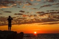 Hipster guy taking pictures of amazing landscape on mobile smart phone Royalty Free Stock Photo