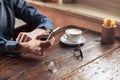 Hipster guy texting with his mobile phone Royalty Free Stock Photo