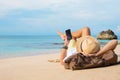 Guy with smartphone lying on the beach Royalty Free Stock Photo