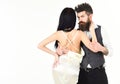 Hipster with lady dressed up, copy space. Elegant couple concept. Couple in love, bride and groom in elegant clothes Royalty Free Stock Photo