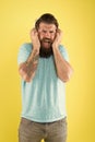 Hipster listen broken headphones music gadget. Hateful song. Music taste. Bearded guy dislike music. Irritating sound