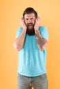 Hipster listen broken headphones music gadget. Hateful song. Music taste. Bearded guy dislike music. Irritating sound Royalty Free Stock Photo