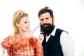 Hipster man with beard and barber woman. Pretty glamour blonde girl style man`s beard. Man style and haircare. Crazy