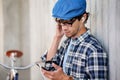 Hipster man with earphones, smartphone and bike Royalty Free Stock Photo