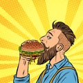 Hipster man eating Burger Royalty Free Stock Photo