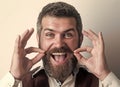 Hipster man with long beard and mustache on happy face. Fashion male model. Guy or bearded businessman. Barber fashion Royalty Free Stock Photo