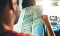 Hipster man looking and point finger on location navigation map in car, tourist traveler driving and hold in male hands europe car Royalty Free Stock Photo