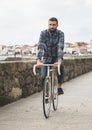 Hipster man riding in a fixie bike Royalty Free Stock Photo