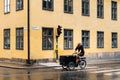 Hipster man riding an old bicycle in Stockholm