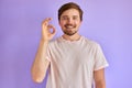 Hipster man shows ok gesture, smiling Royalty Free Stock Photo