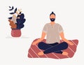 Hipster man sitting with his legs crossed on floor and meditating. Young guy in yoga posture doing meditation, mindfulness