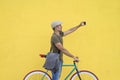 Trendy man taking a selfie with his fixed bike Royalty Free Stock Photo