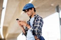 Hipster man texting message on smartphone