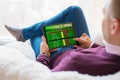 Man using online sports betting service on tablet