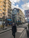 Hipster man walks the streets of downtown Milan, Corso Garibaldi, Italy Royalty Free Stock Photo