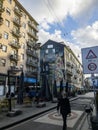 Hipster man walks the streets of downtown Milan, Corso Garibaldi, Italy Royalty Free Stock Photo