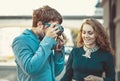 Hipster man wants to take a picture of a beautiful girl Royalty Free Stock Photo