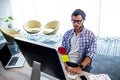 An hipster man working at computer desk Royalty Free Stock Photo