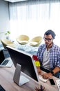 An hipster man working at computer desk Royalty Free Stock Photo