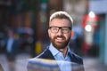 Hipster manager in blue shirt walking in the street