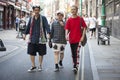 Hipster men dressed in cool Londoner style walking in Brick lane, a street popular among young trendy people Royalty Free Stock Photo