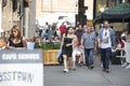 Hipster men and woman dressed in cool Londoner style walking in Brick lane, a street popular among young trendy people Royalty Free Stock Photo