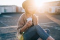 Hipster millennial cute woman on rooftop at sunset