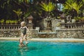 Hipster Mother play with her lovely child in swimming-pool, Bali Royalty Free Stock Photo
