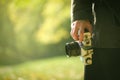 Hipster photographer exploring autumn nature landscapes Royalty Free Stock Photo