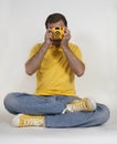 Hipster photographer in yellow clothing