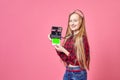 Hipster photographer young woman making photo using retro camera. Funny Girl with instant camera smiling on shot. Royalty Free Stock Photo