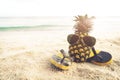 Hipster pineapple on beach - fashion in summer