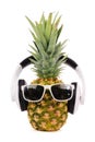 Hipster pineapple with sunglasses and headphones isolated on white