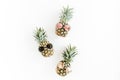 Hipster pineapples in glasses on white background. Flat lay, top view