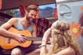 Hipster playing guitar for girls